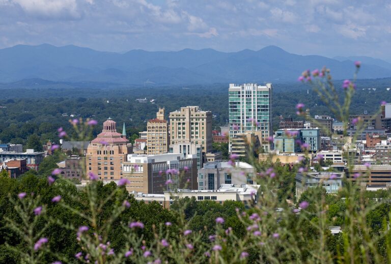 Downtown Asheville skyline with the Buncombe County Courthouse, City Hall and the Jackson Building in front of the Blue Ridge Mountains
