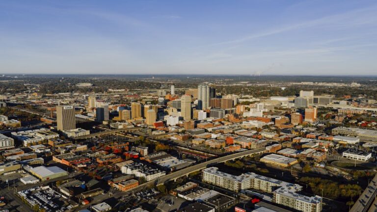 Aerial photograph showcasing Birmingham, Alabama's urban skyline and city layout.