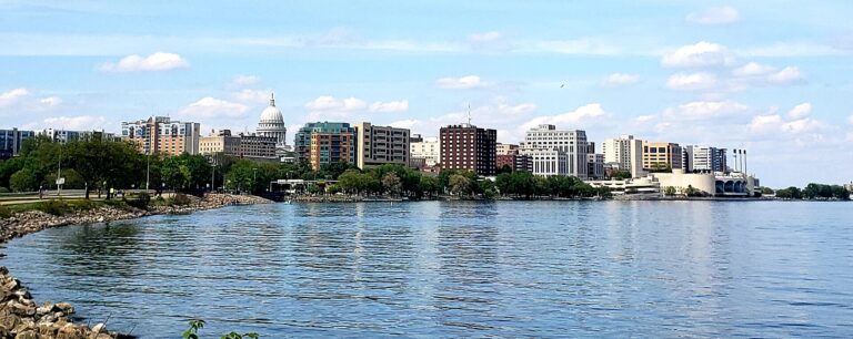 Downtown Madison skyline and the Wisconsin State Capitol dome seen across Lake Monona from John Nolen Drive