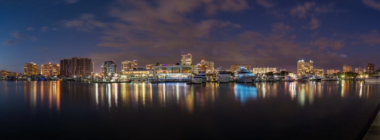 Downtown Sarasota skyline and marina reflected in Sarasota Bay at dusk, seen from Bayfront Park