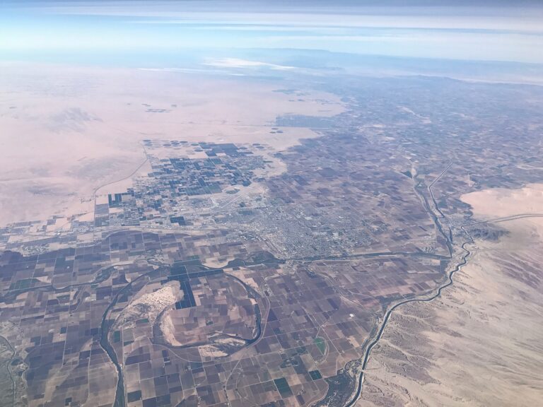 Aerial view of Yuma, Arizona, with the city grid surrounded by irrigated farm fields and the Colorado River