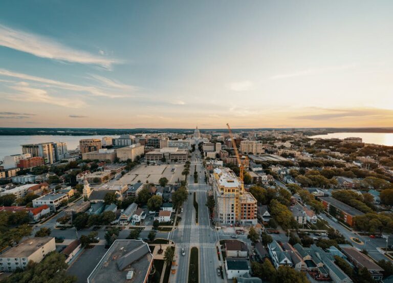 Stunning aerial view of Madison, Wisconsin cityscape at sunset with the Capitol building.