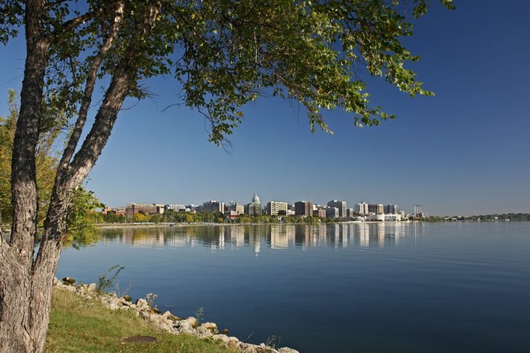 Downtown Madison and the Wisconsin State Capitol dome seen across Lake Monona on a clear fall morning